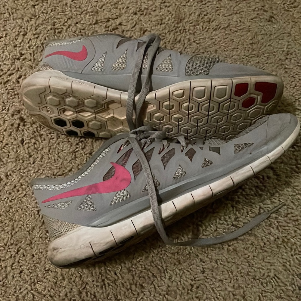 Gray pink Nike runners